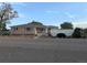 Charming single story home with brick accents and manicured front yard landscaping at 1009 Bush St, Brighton, CO 80601