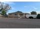 Charming single story home with brick accents and manicured front yard landscaping at 1009 Bush St, Brighton, CO 80601