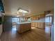 Bright kitchen with hardwood floors, stainless steel appliances and ample cabinetry at 1009 Bush St, Brighton, CO 80601