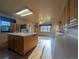 Spacious kitchen with center island, white countertops and modern appliances at 1009 Bush St, Brighton, CO 80601