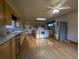 Kitchen with hardwood floors, stainless steel appliances, and center island cooktop at 1009 Bush St, Brighton, CO 80601