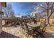 A charming backyard deck with dining set and outdoor grill perfect for entertaining and enjoying the outdoors at 14023 W Amherst Pl, Lakewood, CO 80228