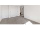 Comfortable bedroom with carpet, a closet, and an open doorway, offering ample space and storage at 14023 W Amherst Pl, Lakewood, CO 80228