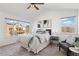 Bright bedroom boasts lots of natural light and a beautiful view, and modern decor at 14023 W Amherst Pl, Lakewood, CO 80228
