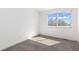 This bedroom offers neutral carpeting, a sunny window, and is freshly painted, ready for your personal touch at 14023 W Amherst Pl, Lakewood, CO 80228