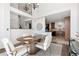 Open dining area with access to the kitchen and staircase; neutral colors throughout at 14023 W Amherst Pl, Lakewood, CO 80228