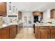 Gourmet kitchen with granite counters, island, and access to the backyard at 14023 W Amherst Pl, Lakewood, CO 80228