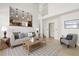 Bright living room showcases an open layout with the kitchen view, with a neutral palette and modern decor at 14023 W Amherst Pl, Lakewood, CO 80228
