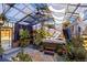 A spacious sunroom with a hot tub, many plants, and draped ceiling, offering the perfect indoor oasis at 14023 W Amherst Pl, Lakewood, CO 80228