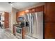Modern kitchen with stainless steel appliances, granite countertops, and ample cabinet space at 9039 E Panorama Cir # C204, Englewood, CO 80112