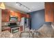 Well-lit kitchen with modern appliances, granite countertops, and ample cabinet space at 9039 E Panorama Cir # C204, Englewood, CO 80112