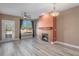 Inviting living area showcasing a fireplace, a ceiling fan, and a view from the window at 9039 E Panorama Cir # C204, Englewood, CO 80112
