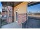 Apartment brick patio with metal railing and closed BBQ grill at 9039 E Panorama Cir # C204, Englewood, CO 80112