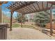 Backyard featuring pergola, patio, manicured landscaping and privacy fence at 2344 S Lupine St, Denver, CO 80228