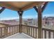 Balcony with a view of rooftops and mountains in the background at 2344 S Lupine St, Denver, CO 80228