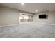 Expansive basement area featuring plush carpeting, recessed lighting, and a stylish wet bar at 2344 S Lupine St, Denver, CO 80228