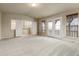 Large bedroom with neutral walls, carpeted floors and multiple windows for natural light at 2344 S Lupine St, Denver, CO 80228