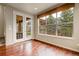 Inviting breakfast nook with hardwood floors, lots of natural light and access to the backyard at 2344 S Lupine St, Denver, CO 80228