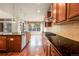 Spacious kitchen with granite counters, stainless appliances, hardwood floors and plenty of natural light at 2344 S Lupine St, Denver, CO 80228