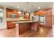 Modern kitchen featuring a center island, stainless steel appliances, and hardwood floors at 2344 S Lupine St, Denver, CO 80228