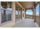 A covered patio boasts a mountain view with wooden railings and french door access at 2344 S Lupine St, Denver, CO 80228