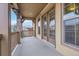 Relaxing outdoor patio featuring a mountain view, wooden railing and french doors at 2344 S Lupine St, Denver, CO 80228
