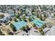 Community amenities shown from above, including tennis courts, a pool, and other recreational facilities at 7340 Brixham Cir, Castle Pines, CO 80108