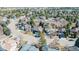 Overhead view showing the property's position in a scenic neighborhood with winding streets and green spaces at 7340 Brixham Cir, Castle Pines, CO 80108