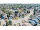 Beautiful aerial view showcasing the neighborhood's layout, mature trees, and well-maintained homes at 7340 Brixham Cir, Castle Pines, CO 80108