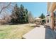 Spacious backyard featuring a patio, outdoor seating, and lush green lawn perfect for outdoor entertaining at 7340 Brixham Cir, Castle Pines, CO 80108