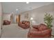The basement has a relaxed sitting space, complete with couches and natural light from the backyard at 7340 Brixham Cir, Castle Pines, CO 80108