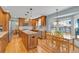 Updated kitchen featuring stainless steel appliances, a center island, and custom cabinetry at 7340 Brixham Cir, Castle Pines, CO 80108