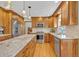 Updated kitchen featuring stainless steel appliances, a center island, and custom cabinetry at 7340 Brixham Cir, Castle Pines, CO 80108
