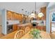 Updated kitchen featuring stainless steel appliances, a center island, and custom cabinetry at 7340 Brixham Cir, Castle Pines, CO 80108