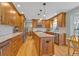 Updated kitchen featuring stainless steel appliances, a center island, and custom cabinetry at 7340 Brixham Cir, Castle Pines, CO 80108