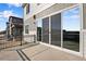 Back patio with privacy fence and sliding door access to the home at 10022 Wheeling St, Commerce City, CO 80022
