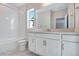 Bright bathroom with dual vanity, tub-shower combo and marble countertop at 10022 Wheeling St, Commerce City, CO 80022