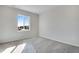 Carpeted bedroom featuring neutral walls, bright light and a sunny window at 10022 Wheeling St, Commerce City, CO 80022
