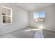 Carpeted bedroom with neutral walls and large windows letting in ample natural light at 10022 Wheeling St, Commerce City, CO 80022