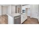Kitchen with an island with stainless steel dishwasher and oven at 10022 Wheeling St, Commerce City, CO 80022