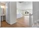 Bright, open-concept living area featuring hardwood floors, island and plenty of natural light at 10022 Wheeling St, Commerce City, CO 80022