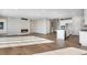 Bright and airy living area with fireplace, hardwood floors, and a seamless kitchen view at 10022 Wheeling St, Commerce City, CO 80022