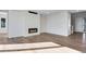 Spacious living room with hardwood floors and modern fireplace at 10022 Wheeling St, Commerce City, CO 80022