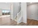 Bright foyer with staircase, hardwood floors, and large sliding glass doors at 10022 Wheeling St, Commerce City, CO 80022