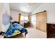 Bedroom features a desk, mural, and a sliding barn door at 43010 Ptarmigan Ranch St, Parker, CO 80138