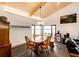 Traditional dining room with wood furniture, natural light, and views to the exterior at 43010 Ptarmigan Ranch St, Parker, CO 80138