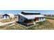 Modern home featuring a unique design, metal roof, siding accents, a deck, and ample outdoor space at 43010 Ptarmigan Ranch St, Parker, CO 80138