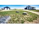 Modern home exterior featuring a spacious yard, garage, and additional storage building at 43010 Ptarmigan Ranch St, Parker, CO 80138