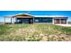 Contemporary home with a covered porch, attractive stonework, modern design, and well-maintained lawn at 43010 Ptarmigan Ranch St, Parker, CO 80138