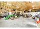Large garage with high ceilings providing ample storage space for a variety of vehicles and equipment at 43010 Ptarmigan Ranch St, Parker, CO 80138